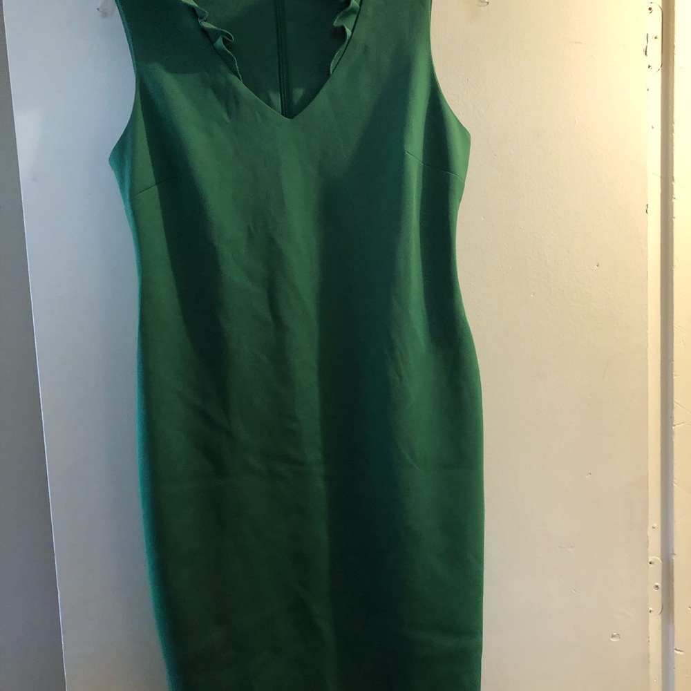 Green mid length dress with ruffle neckline